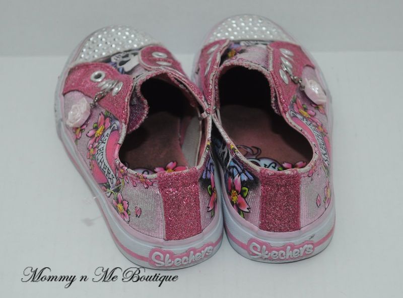   your consideration is a girls Skechers twinkle toes shoes in size 12