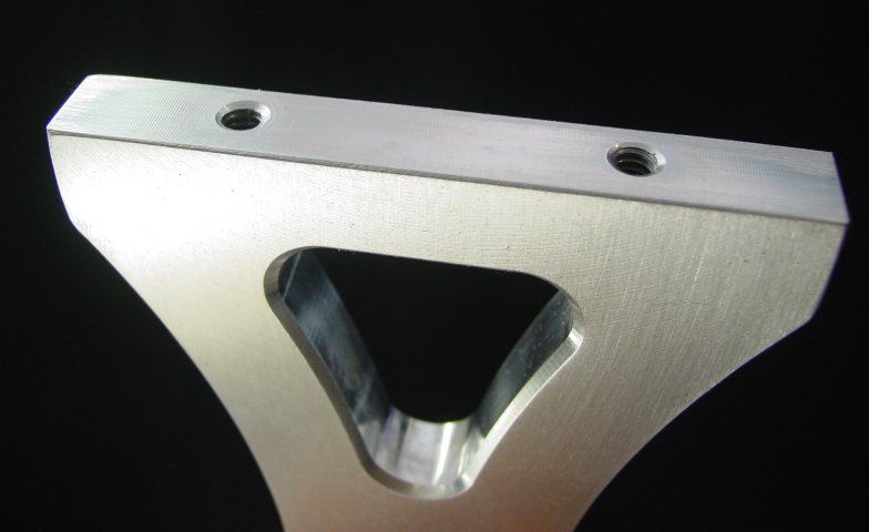 the tapped holes in the side pieces have a lead in chamfer to make it 